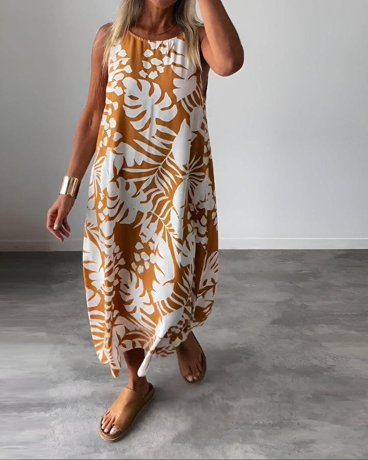 Vibrant tropical print sleeveless maxi dress. Women's comfortable beachwear & summer vacation outfit.