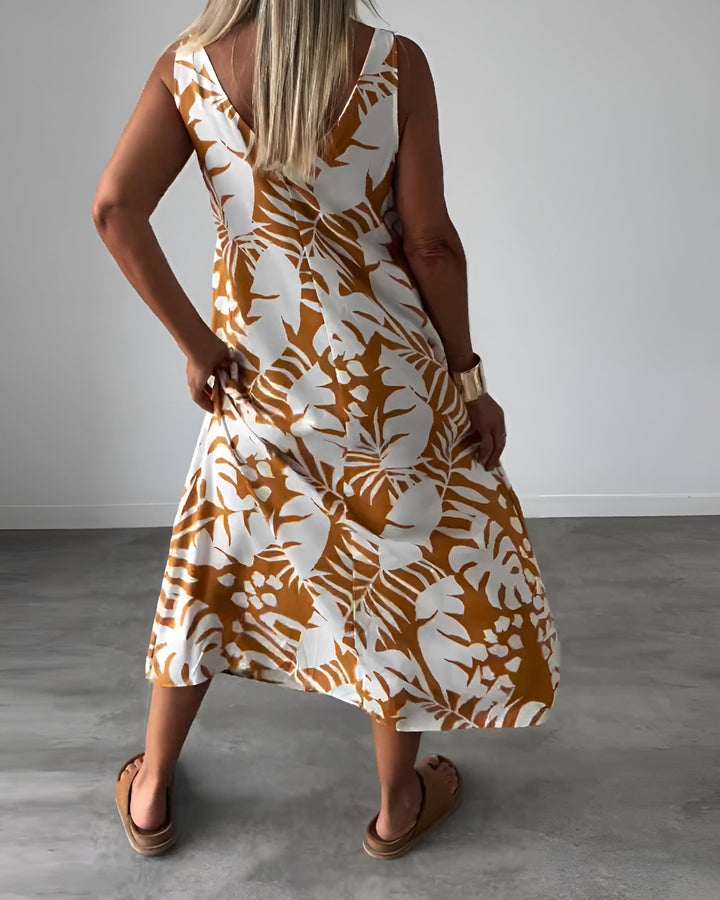 Chic tropical print sleeveless maxi dress. Women's fashion essential for beach, vacation & comfortable summer days.