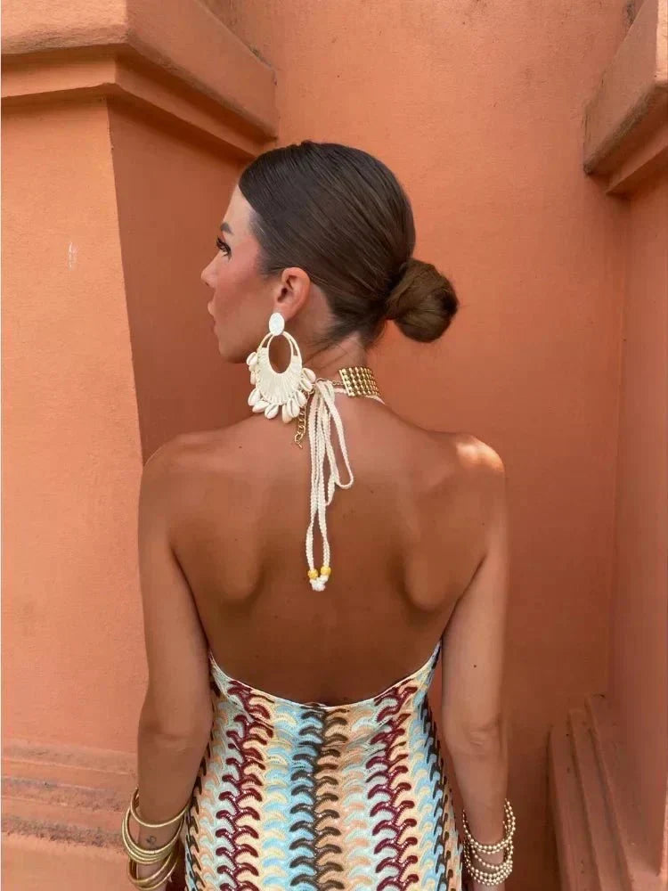Beautiful halter neck patterned maxi dress for women, perfect for warm summer days & resort fashion.